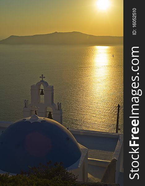 View from the famous Santorini landmark at sunset. View from the famous Santorini landmark at sunset