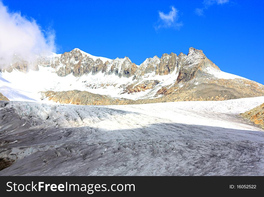 Glacier With Snow Capped Mountains