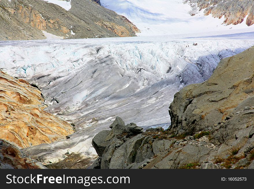 Glacier With Snow Capped Mountains