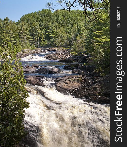 A set rapids in a northern Ontario river, shot in bright daylight. A set rapids in a northern Ontario river, shot in bright daylight.