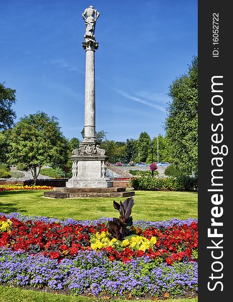 The flower garden and statue of James Robert Creighton in Hardwicke Circus, Carlisle, Cumbria, England. The flower garden and statue of James Robert Creighton in Hardwicke Circus, Carlisle, Cumbria, England