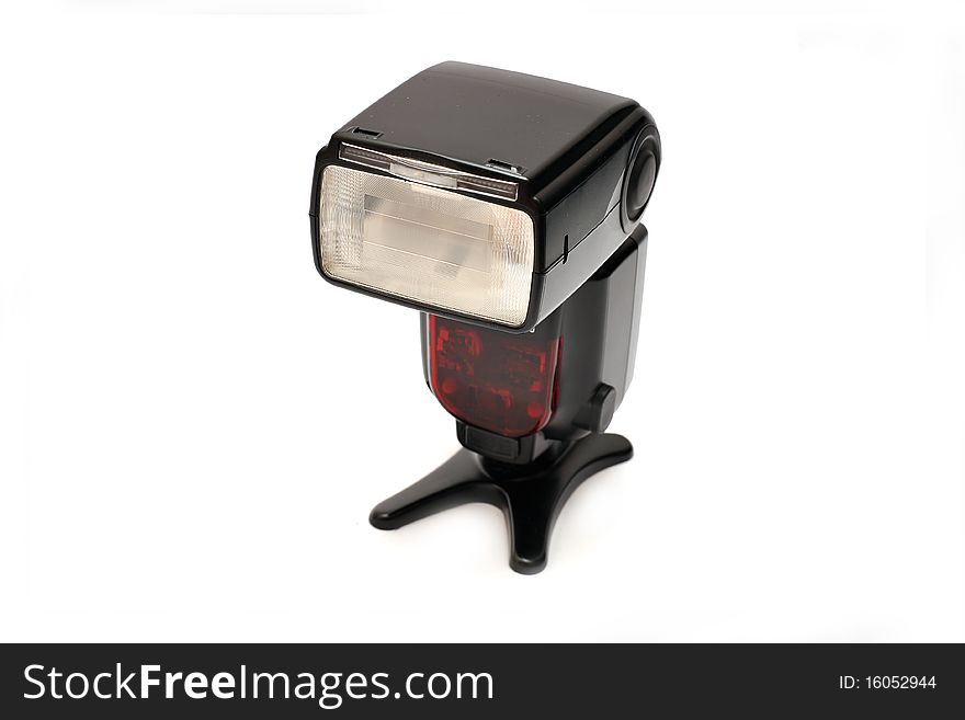 A professional flashgun isolated on a white background.