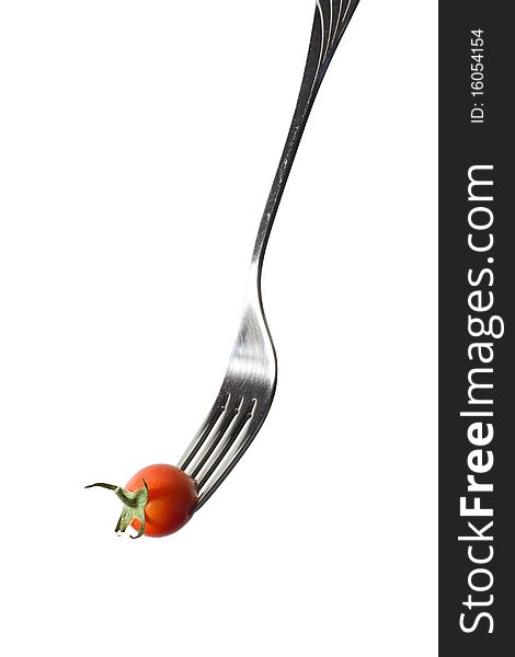 Fresh cherry tomato on the fork (isolated on white)