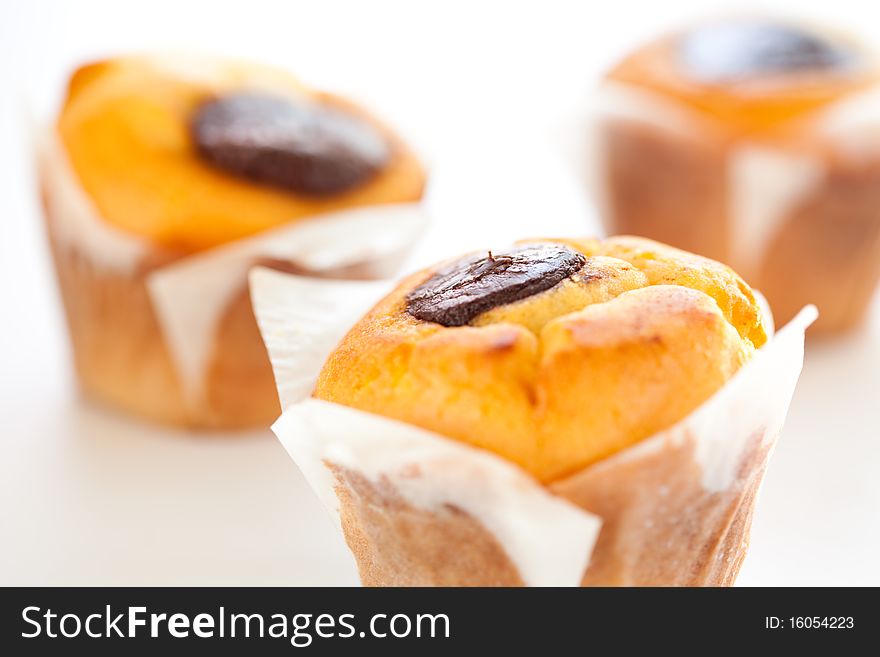 Tasty homemade muffin filled with black chocolate. Tasty homemade muffin filled with black chocolate