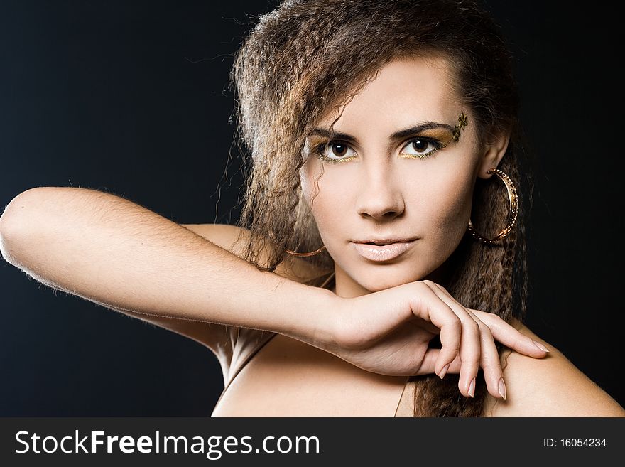 Elegant fashionable woman in golden dress