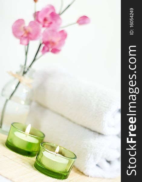 Composition Of Pink Orchid, Towel And Two Candles