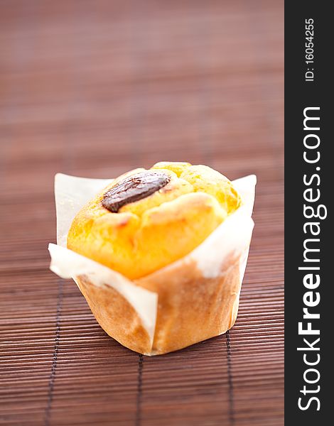 Tasty homemade muffin filled with black chocolate. Tasty homemade muffin filled with black chocolate