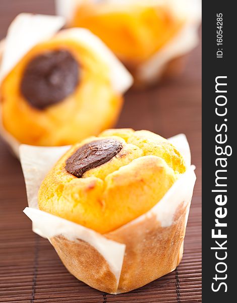 Tasty homemade muffin filled with black chocolate. Tasty homemade muffin filled with black chocolate