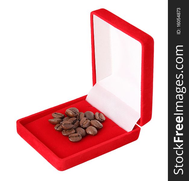 Handful of coffee beans in red box, as a jewelry. It is isolated on white background. Handful of coffee beans in red box, as a jewelry. It is isolated on white background.