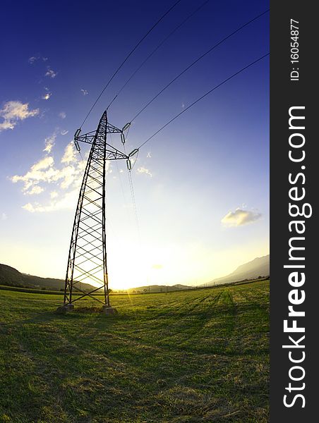 Electric tower on the meadow