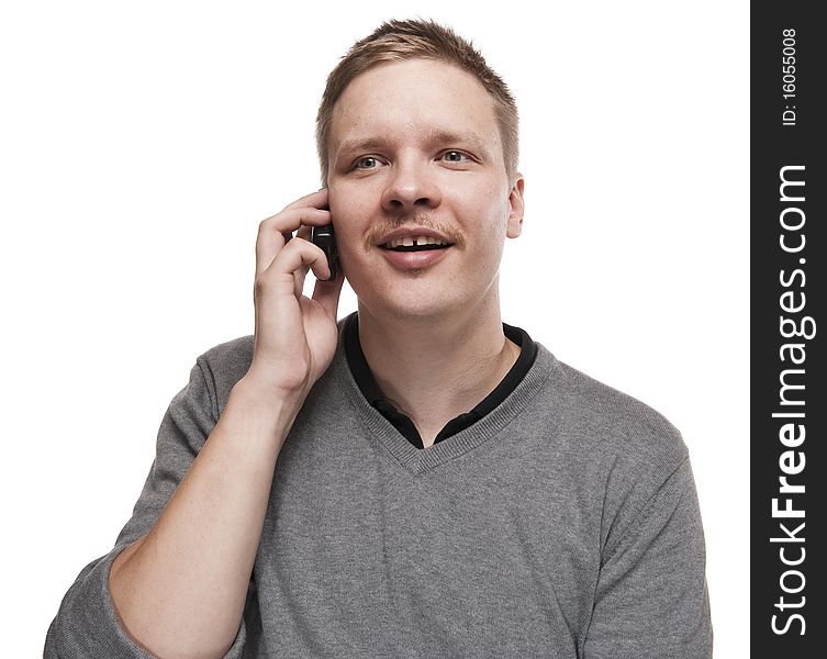 Happy Young Man Speaking On Telephone.