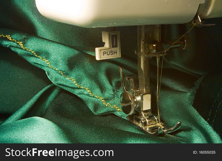 Sewing machine detail with a thread and cloth