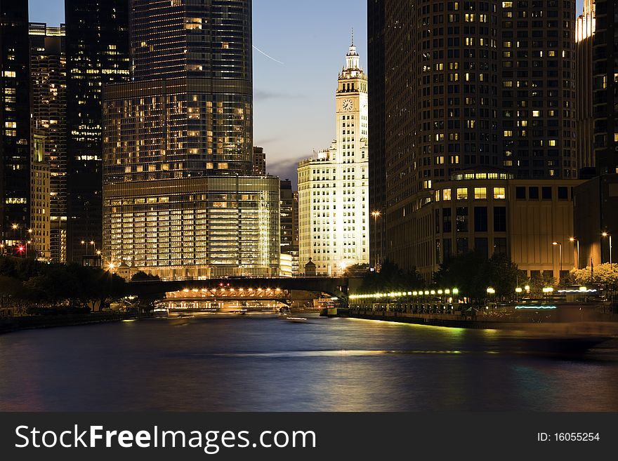 Wrigley Building surrounded by skyscrapers - Chicago, IL.