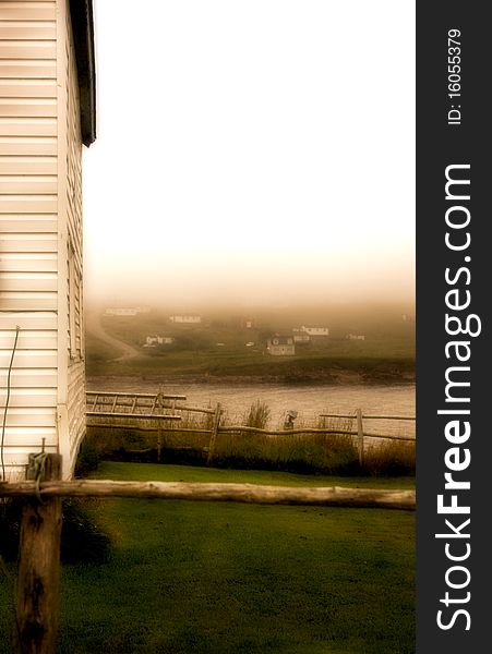 A grey but beautiful foggy evening in a small fishing village in Newfoundland. A grey but beautiful foggy evening in a small fishing village in Newfoundland.