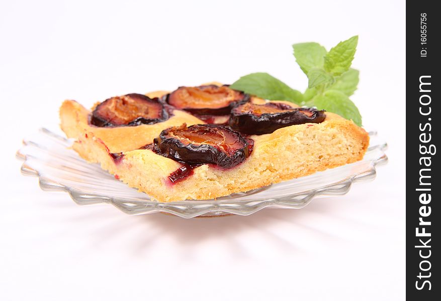 Piece of Plum Pie decorated with a mint twig