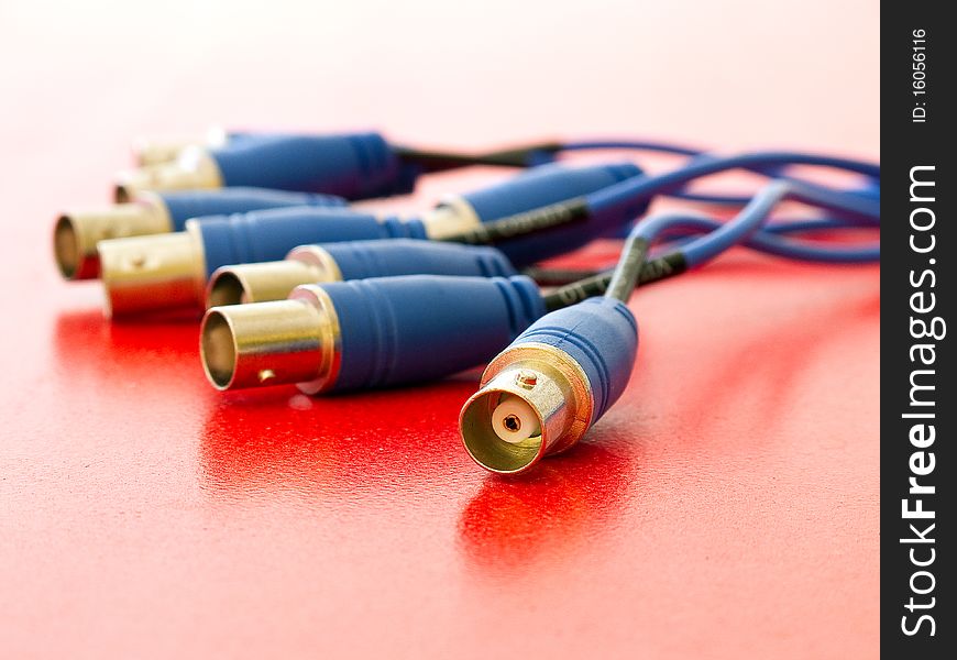 Blue set of connectors on red background