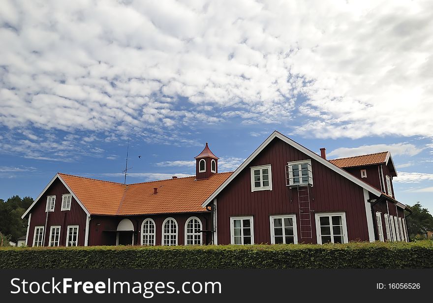 Swedish red color public building in summer time. Swedish red color public building in summer time