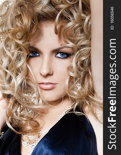 Beautiful fashionable woman with curls