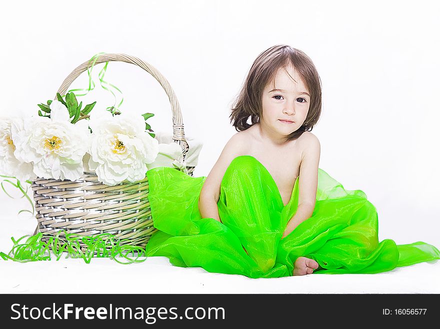 Portrait of a little girl with basket and flowers isolated