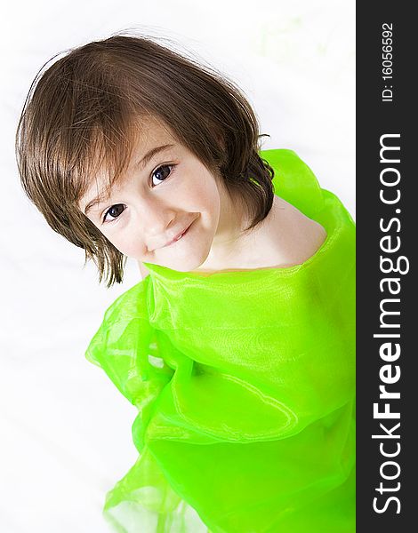 Portrait of a little girl in studio in green isolated. Portrait of a little girl in studio in green isolated