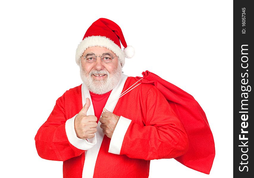 Santa Claus with a full sack saying OK isolated on white background
