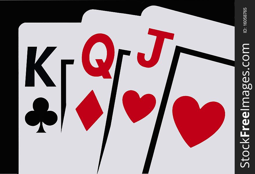 A closeup of three playing cards, a King, Queen and Jack against a clean black background. A closeup of three playing cards, a King, Queen and Jack against a clean black background