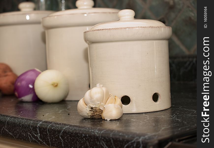 These are containers in the kitchen for keeping fresh potatoes, fresh garlic and fresh onions. These are containers in the kitchen for keeping fresh potatoes, fresh garlic and fresh onions.