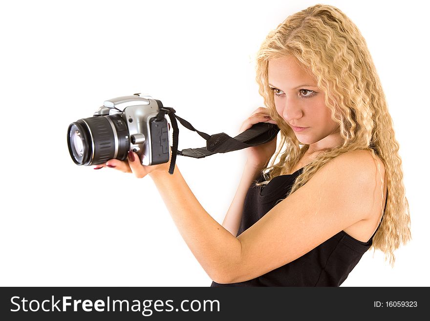 The young beautiful girl with the camera isolated on a white background