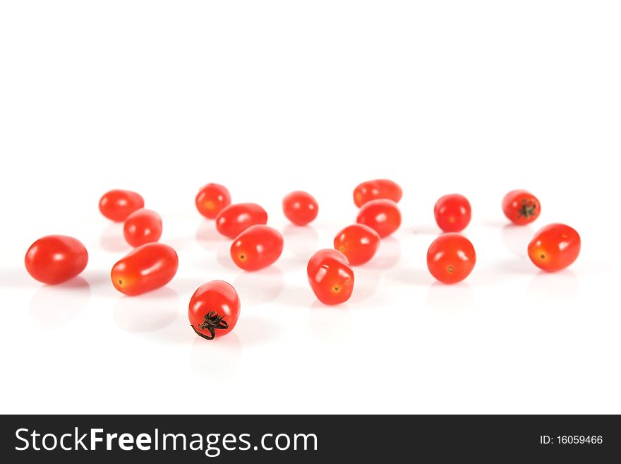 Cherry tomatoes on the white isolated background