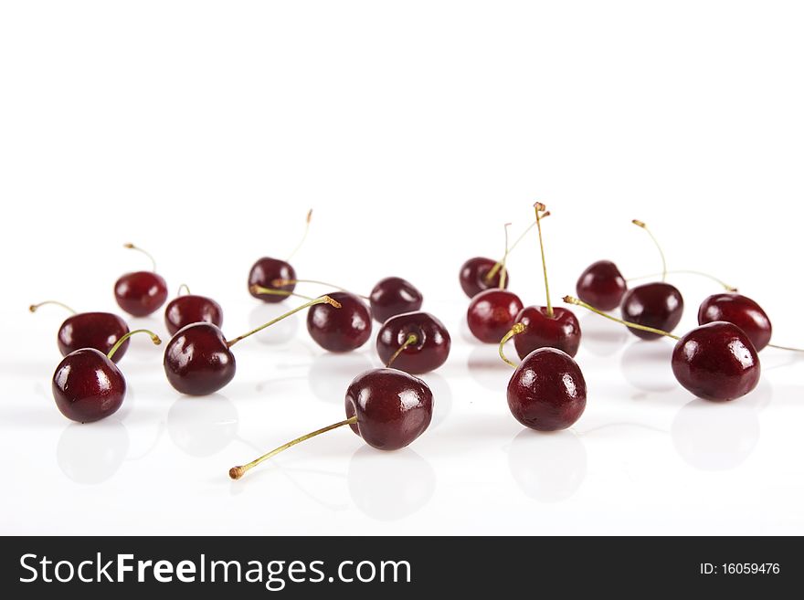 Ripe cherries isolated on white, scattered