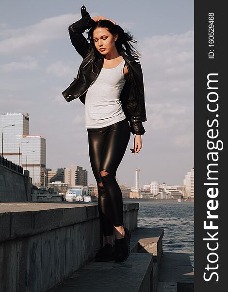 Attractive fitness woman lifestyle portrait. caucasian model walking in the city