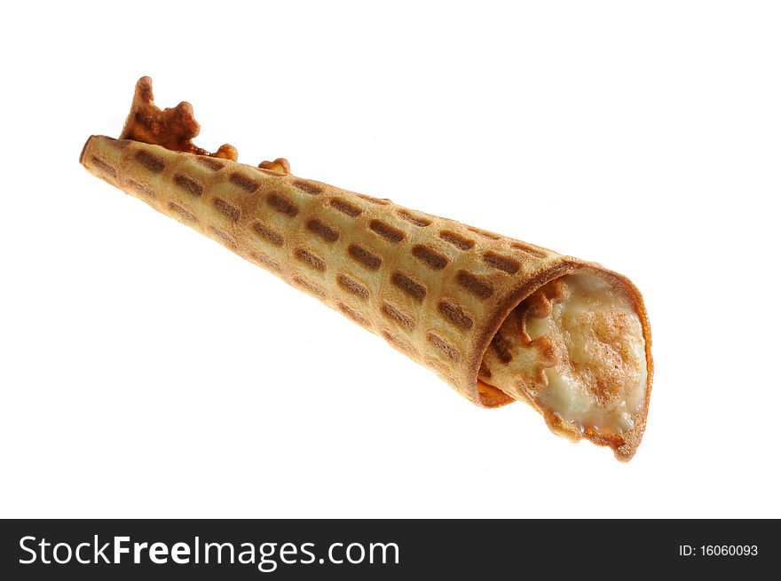 A homemade waffle with cream filling isolated on a white background