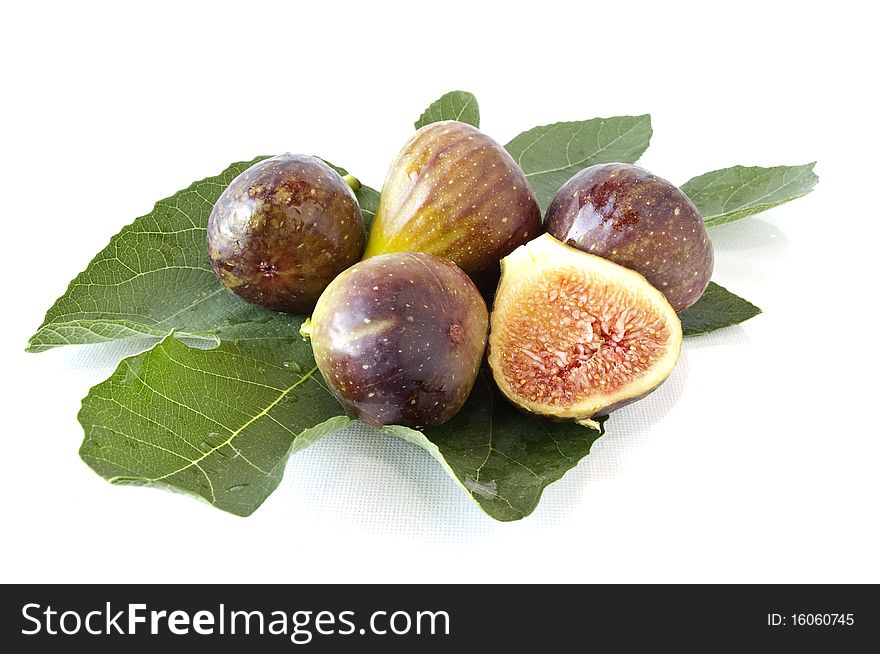 Some freshly picked figs on white background