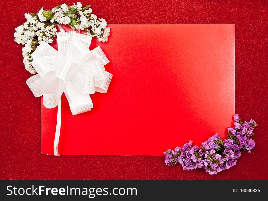 Greeting card with bow and flowers on red background. Greeting card with bow and flowers on red background