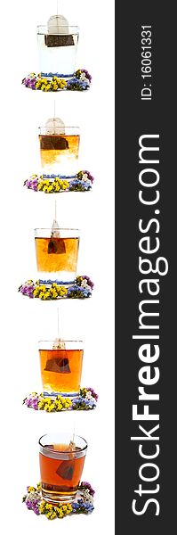 Preparing tea in glass cup with flowers. Isolated on white background