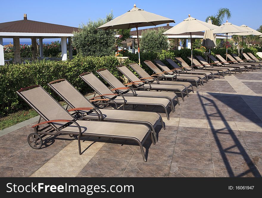 Chaise longue and umbrellas. Turkey.