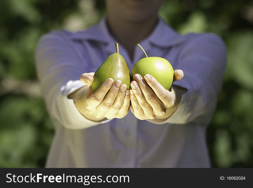 Fresh Fruits In Woman S Hands.