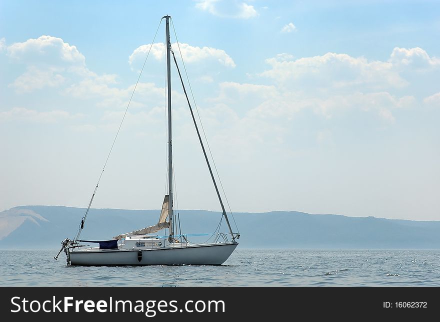 The yacht Anchoring beside coast