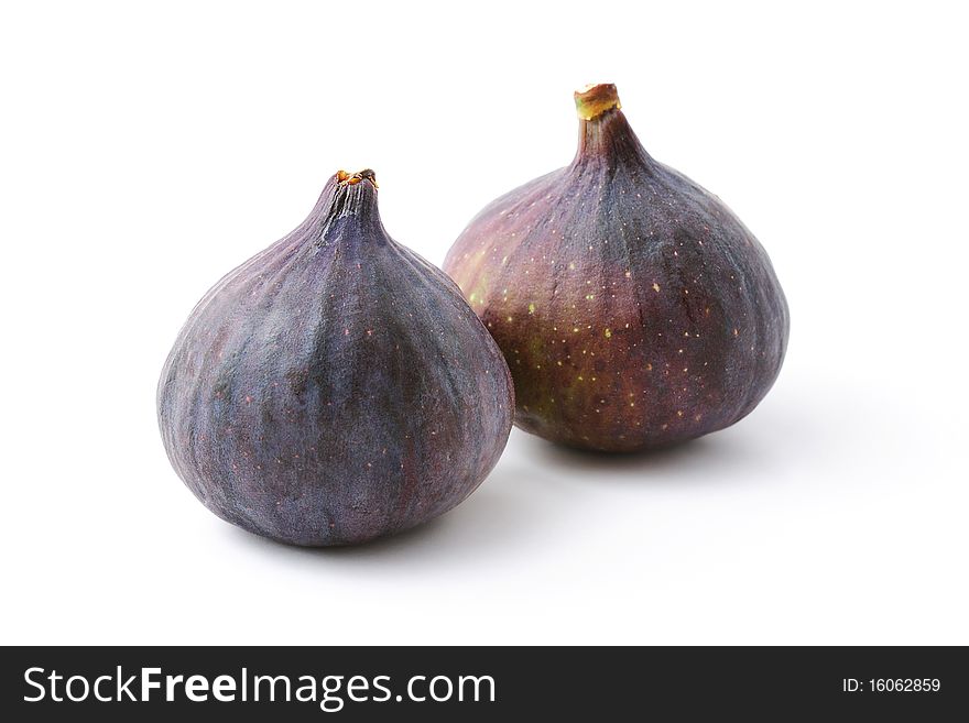 Couple of ripe organic figs isolated on white