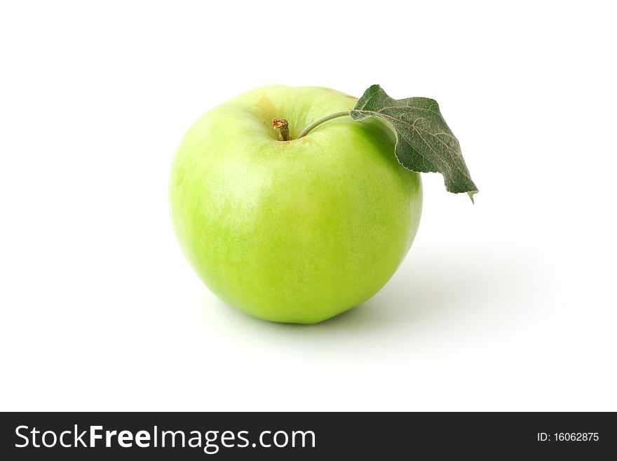 Single green apple with leaf isolated on white background