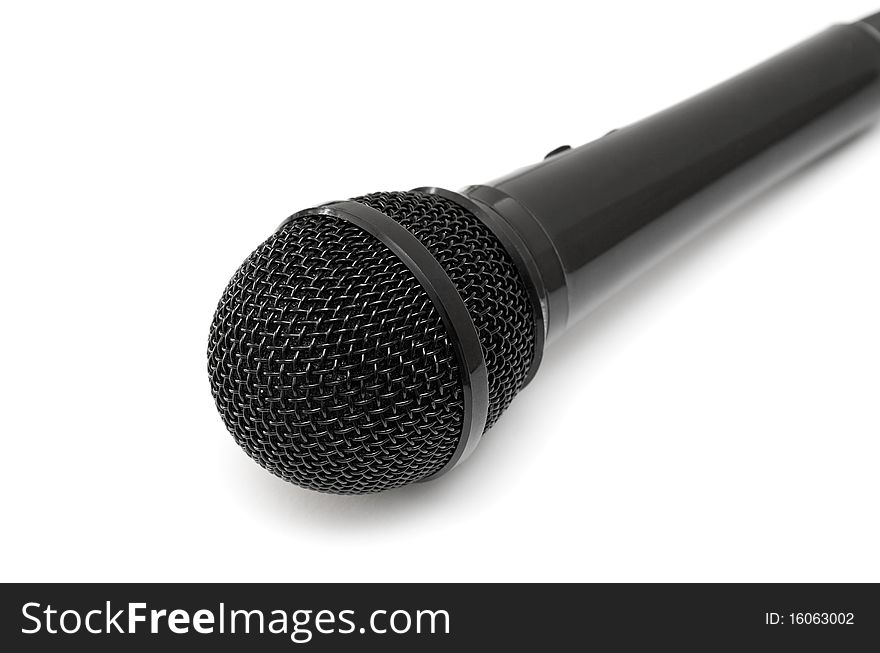 Black microphone isolated on a white background.