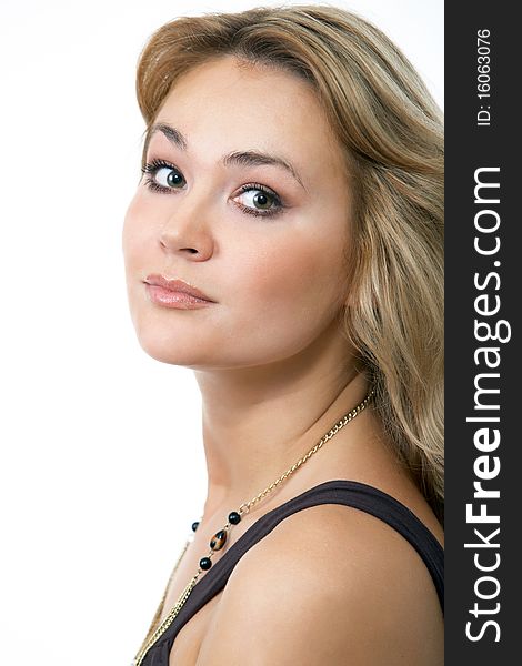 Close up portrait of an attractive blond on a dark background