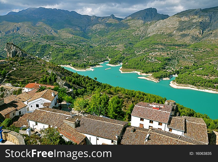 Spain Guadalest mountain sun sky ridge protrusion landscape painting Village blue lake