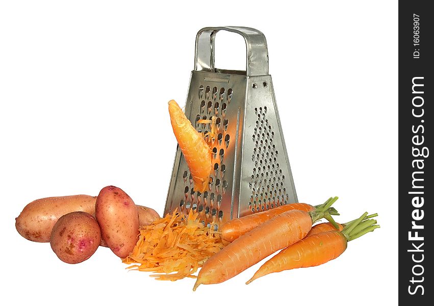 Fresh carrots rubbed on a kitchen grater