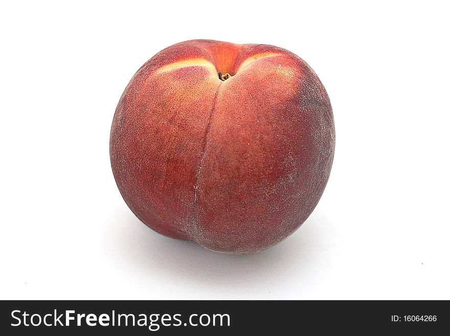 Sweet, juicy, ripe, tasty peach on a white background