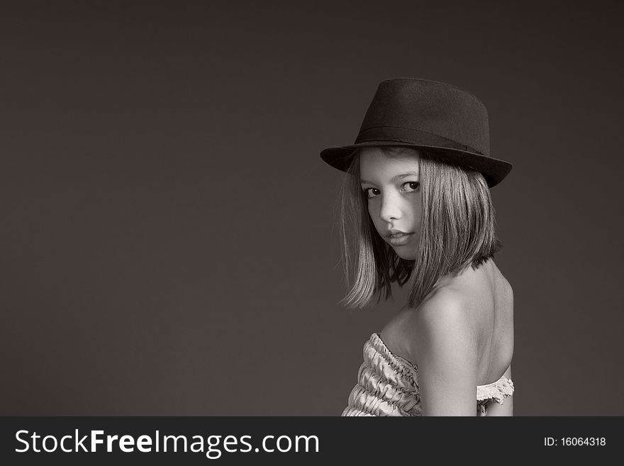 Portrait of happy caucasian girl posing with black hat. Portrait of happy caucasian girl posing with black hat