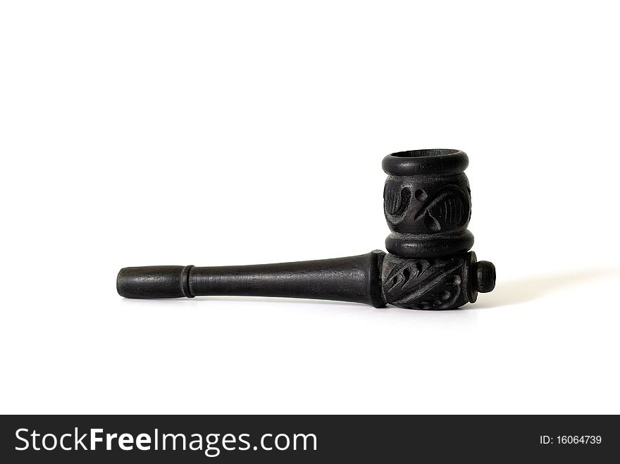 A black smoking pipe with thai wood handicraft isolated on a white background. A black smoking pipe with thai wood handicraft isolated on a white background