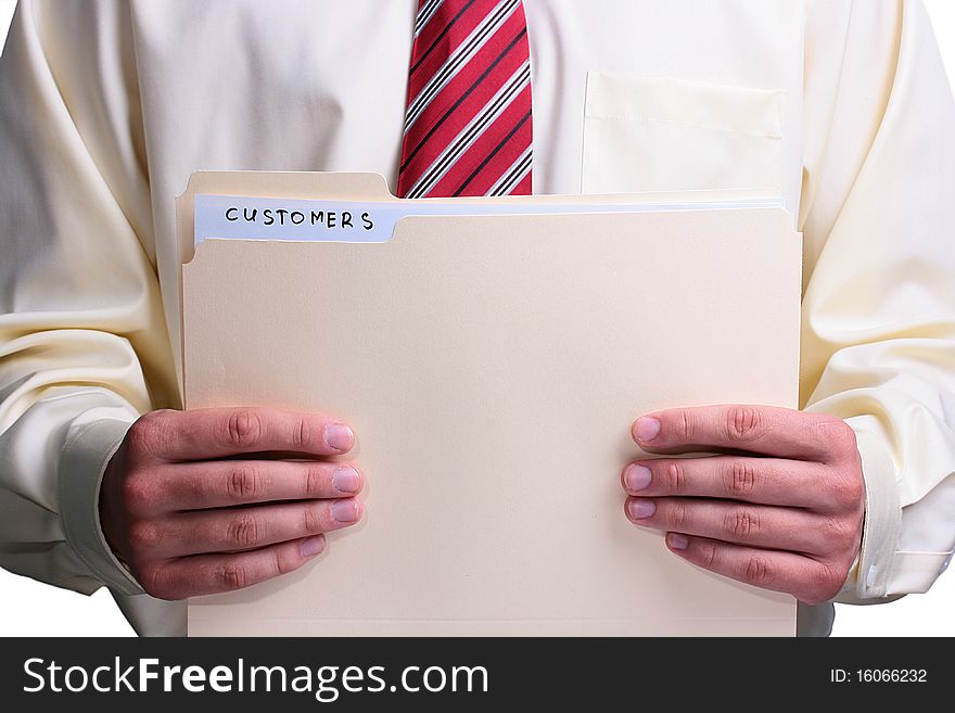 Man in a shirt and a tie holding a manila customer folder. Man in a shirt and a tie holding a manila customer folder.