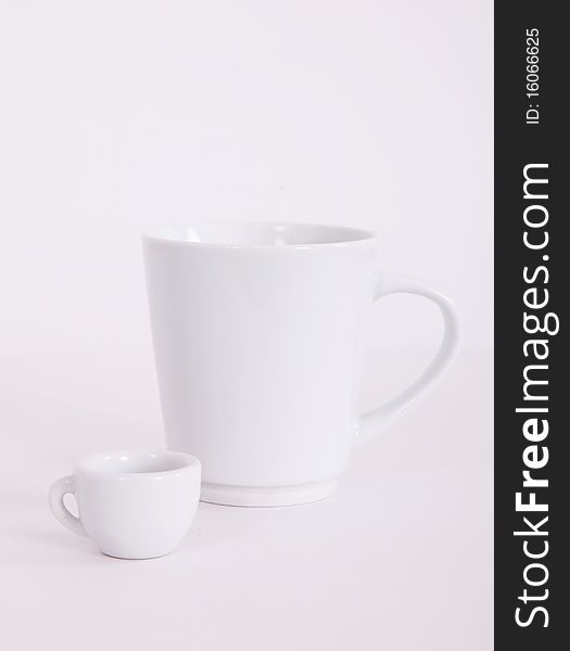 Large white cup and a small. Concept