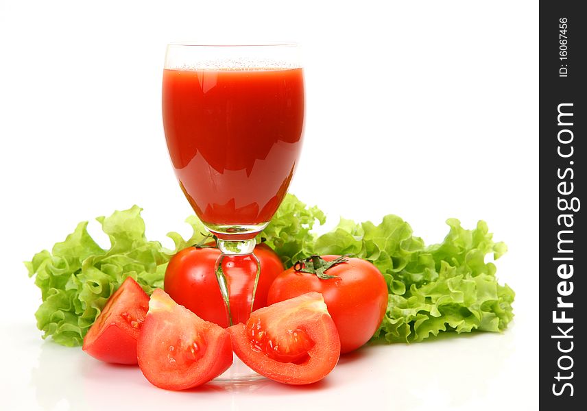 Fresh vegetables and juice on a white background